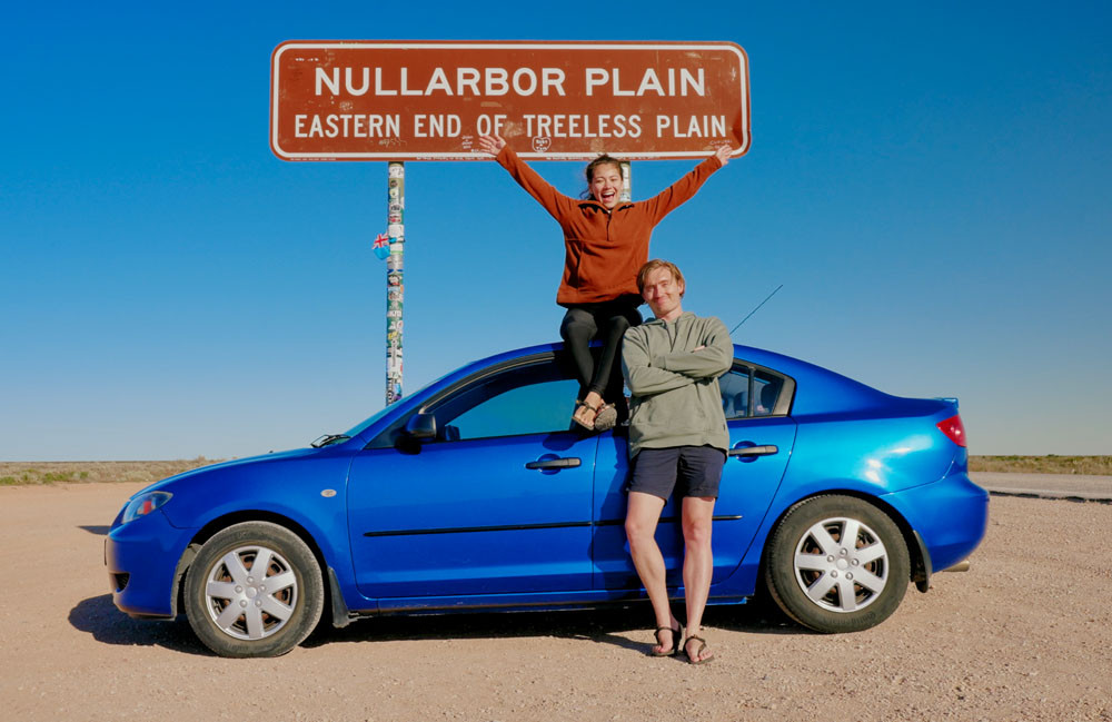 Tia and Cheveyo and their Mazda3 at the end of the Nullabor Plain.