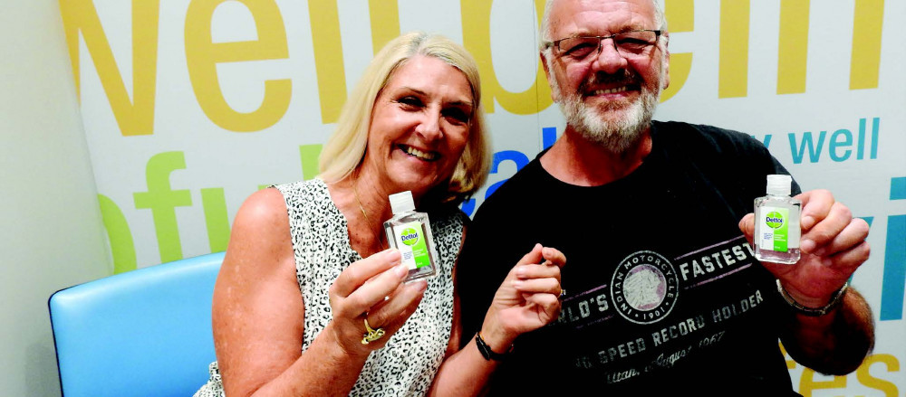 The ‘Dettol Duo’, Greg and Herriet Peck after receiving this Astra- Zeneca vaccinations at Marlin Coast Amcal Pharmacy PHOTO: Peter McCullagh