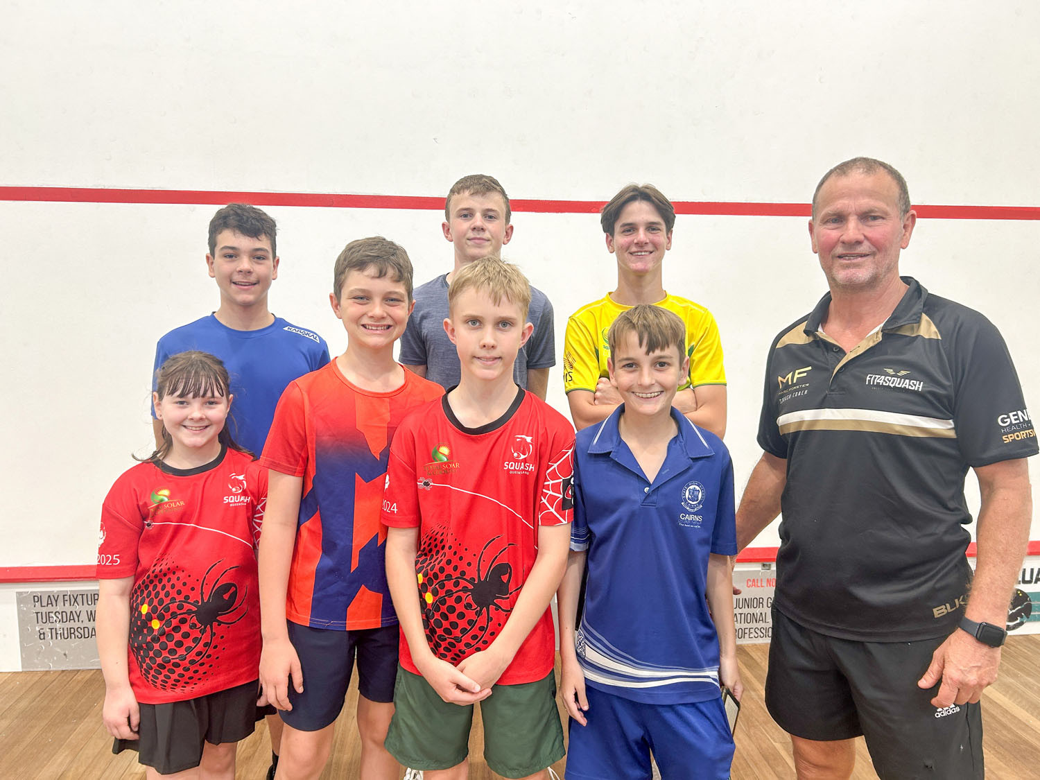 Cairns Squash head coach Marc Forster (right) with local squash players. Picture: Hugh Bohane