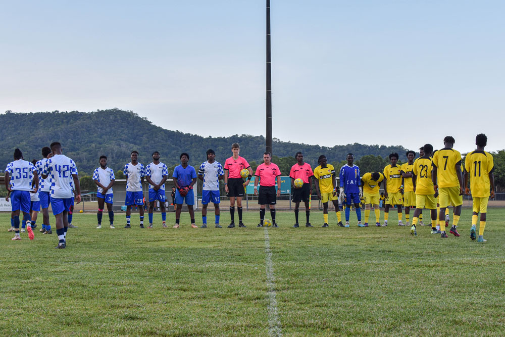 Centro FC (yellow) and Libaah FC prepare for the finals. Pictures: Football Queensland Far North and Gulf