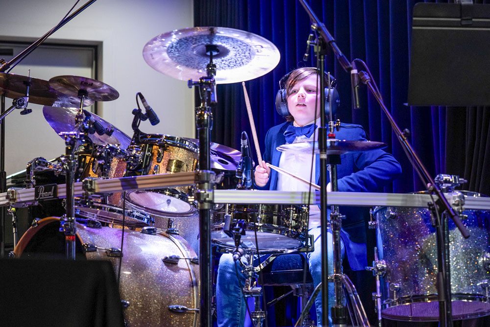 A 2024 drums finalist proudly represents his regional town, taking to the big stage at the Oz Schools Instrumental Championships. Pictures: Oz Schools Instrumental Championships (OSIC)