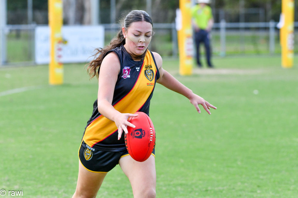 Cairns City Lions’ Daysia Creed-Wray in action during her 100th game for the club. Pictures: AFL Cairns